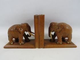 Pair of wooden book ends with carved elephants. 6" tall.