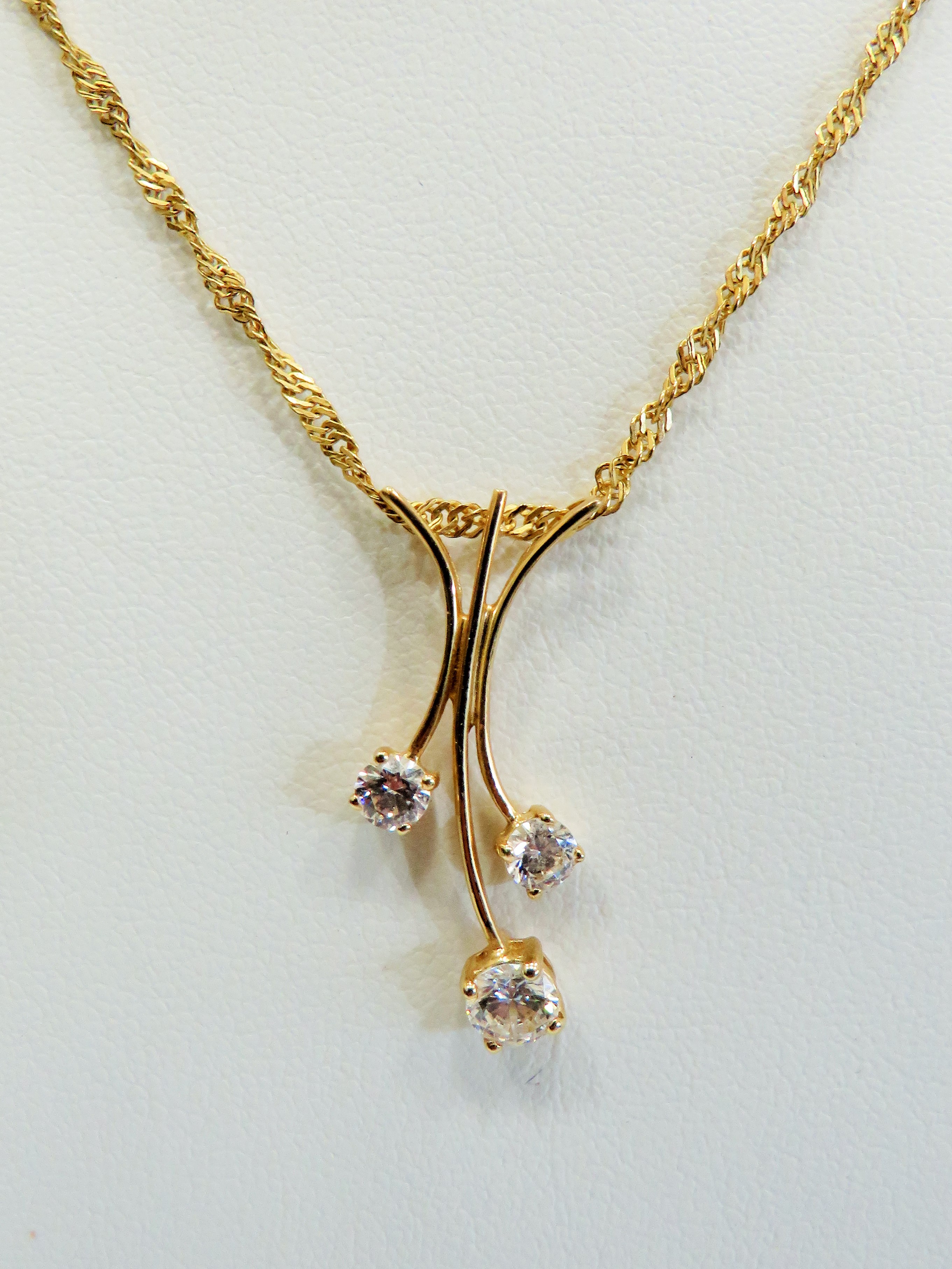 14ct Trident style pendant set with clear CZ gemstones. Hung upon a 14ct , 21 inch chain.  Total wei - Image 2 of 2