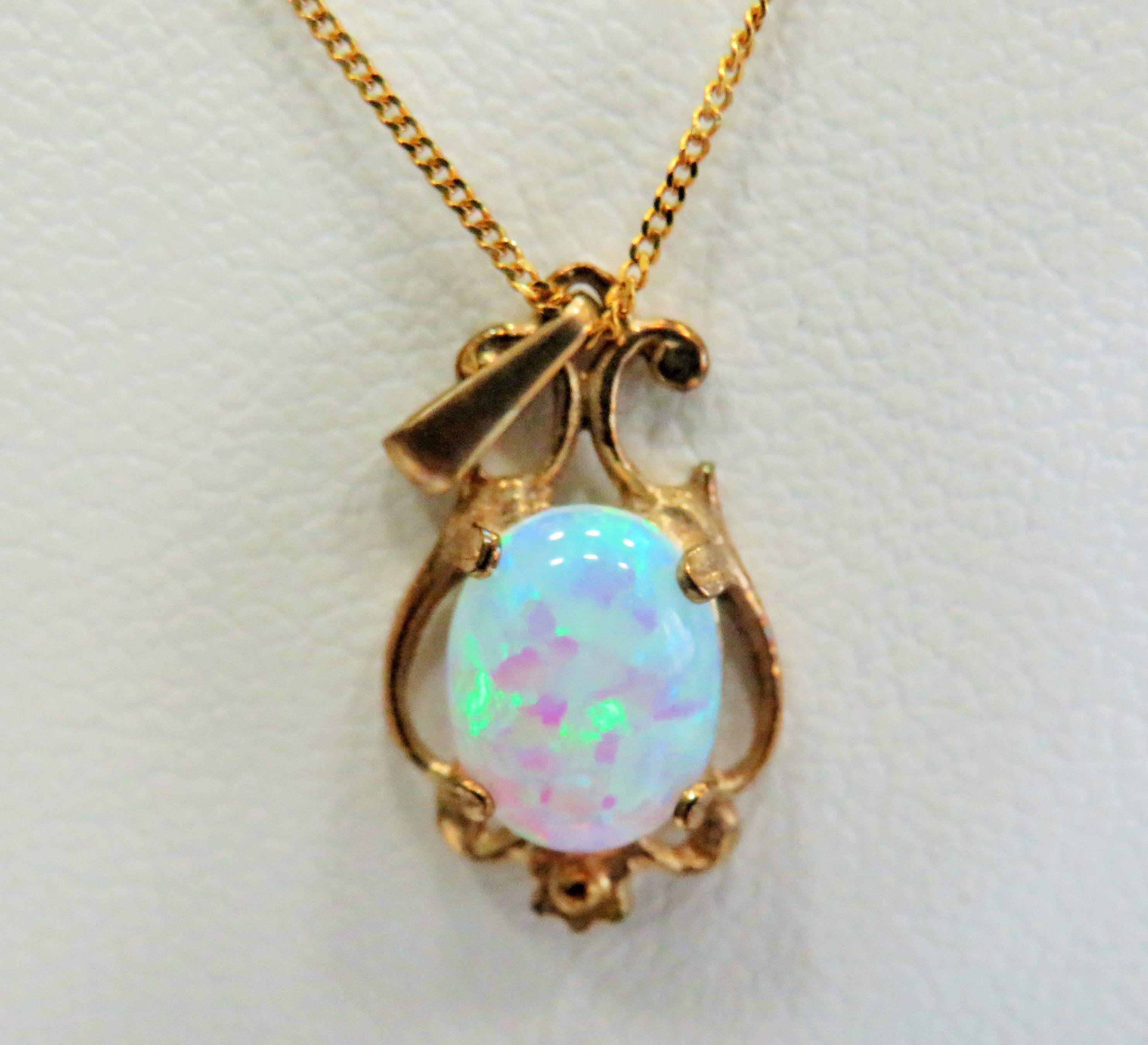 9ct Gold Art Nouveau style pendant set with a high coloured Opal hung on an 18 inch 9ct Chain.  Tota - Image 3 of 3