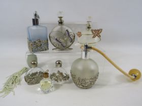 4 Large and 3 small Perfume and atomiser bottles.