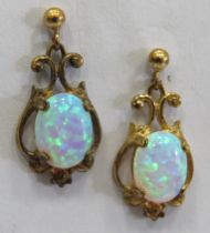 Pair of 9ct Gold Art Nouveau Style Opal set Drop earrings. Total Weight 2.2g