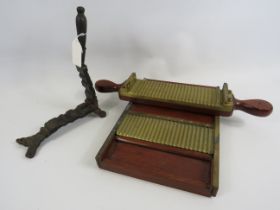 Antique cast iron pill cast and brass and wood pill roller.