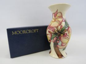 Moorcroft Frangipani vase with box, approx 7 3/4" tall.