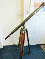 Large metal telescope on a wooden and brass adjustable Tripod mount.