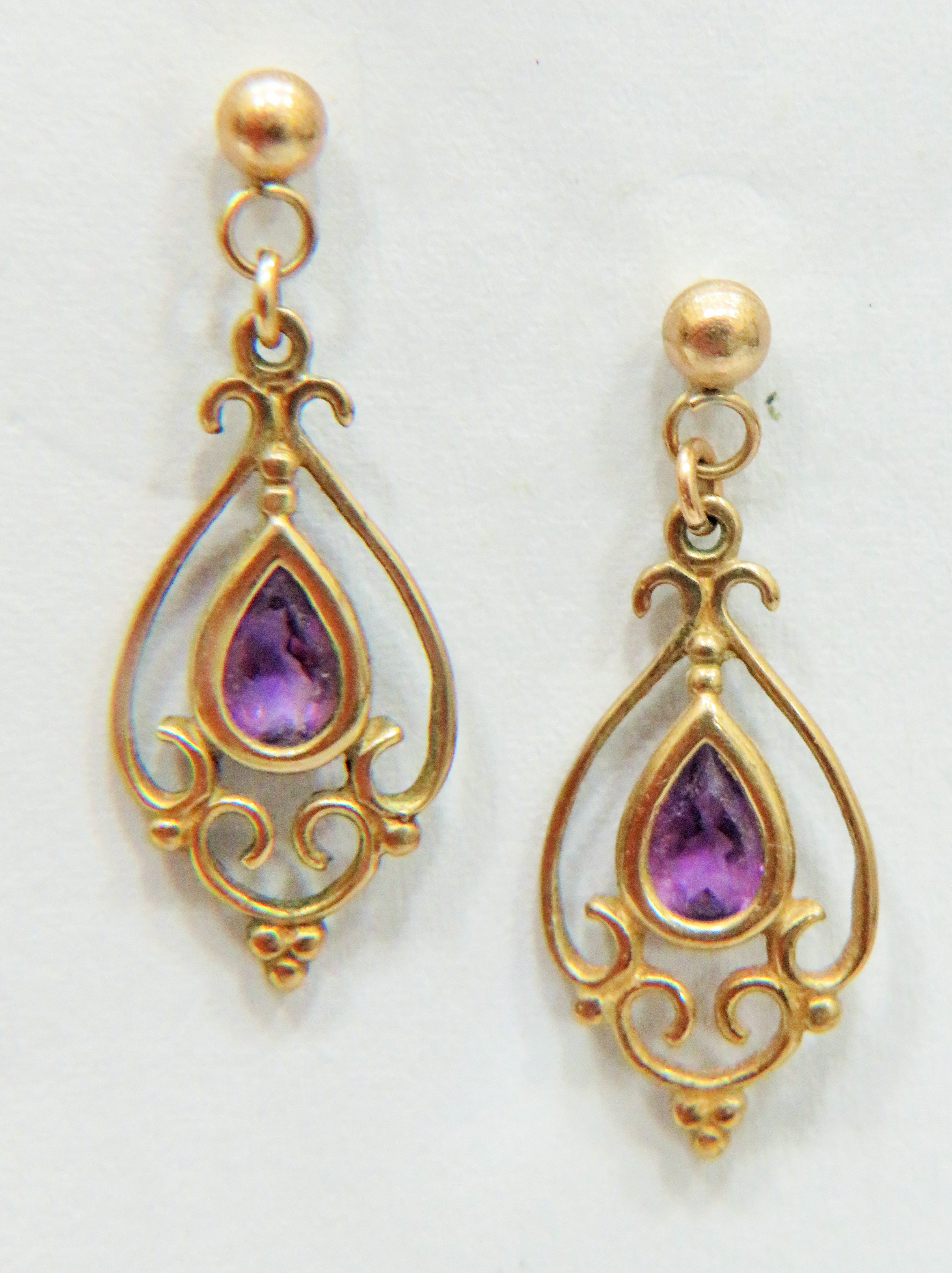 Pair of 9ct Art Nouveau style Amethyst set Drop earrings approx 25mm long with fasteners.   Approx 1