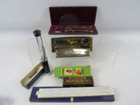 Mixed lot to include a drawing set, telescope, harmonica etc.