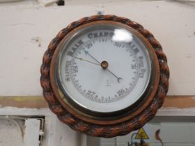 Small enamel faced oak cased barometer, 8" diameter.