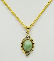 9ct Yellow Gold Pendant set with a Central Jade with Diamond surround. Hung on a 14ct fancy link 22