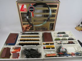 Boxed and part Complete Lima 00 Scale train set. Engines, Rolling Stock, Trackside buildings. See