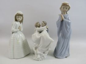 2 Nao figurines of girls praying plus a bride and groom. The tallest measures 11".