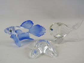 Swarovski Siamese fighting fish, Star fish plus one other swarovski fish figurine.