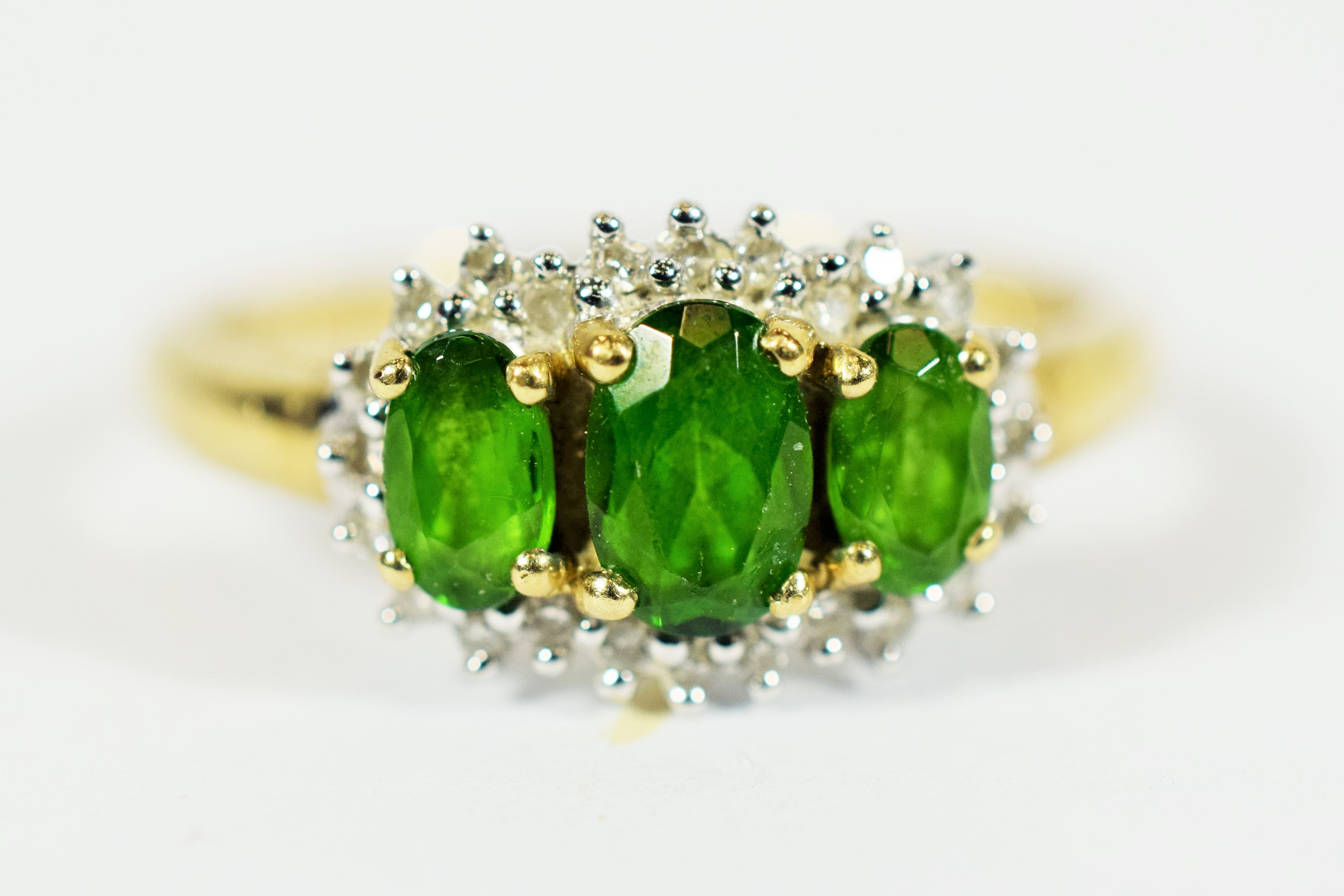 9ct Yellow Gold Ring set with Three Central Emeralds with Diamond Surround..   Finger size 'Q-5 to R