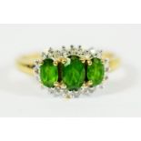 9ct Yellow Gold Ring set with Three Central Emeralds with Diamond Surround..   Finger size 'Q-5 to R