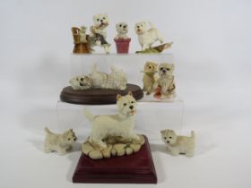 Selection of West Highland terrier dog figurines.