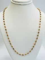 9ct Yellow Gold 20 inch Neck Chain interspersed with small globes between links. Total weight appro