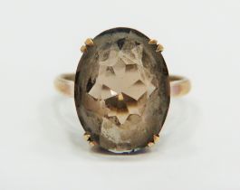 9ct Yellow Gold ring set with a large Oval Smokey Quartz which measures 15 x 10 mm. Finger size 'L-