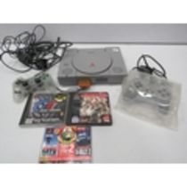 Playstation one with 2 controllers and 2 games. PA1383