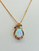 9ct Gold Art Nouveau style pendant set with a high coloured Opal hung on an 18 inch 9ct Chain. Tota
