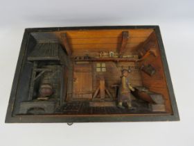 Vintage Swiss hand carved musical diorama in working condition, 13" by 9".