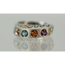 14ct White gold multi coloured gemstone set ring with raised pierced mount. Finger size 'V' Total we