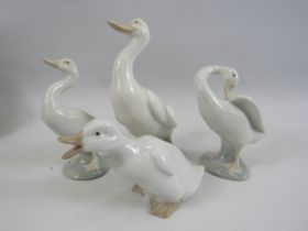 2 Nao and 2 Lladro duck figurines.