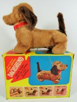 Vintage Battery Operated leash controlled Dachshund with original box. May require batteries to run.