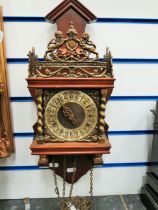 Pretty Wood and Brass weight driven wall clock. Runs but would need weights to make good. Consider