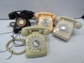 4 Vintage dial round telephones.