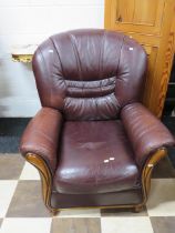 Soft leather armchair with exposed dark wood frame.. See photos. S2