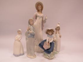 4 Lladro figures plus one other. The tallest has damage to one hand see pics.