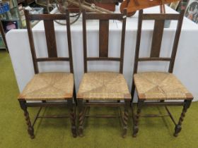 Trio of early 20th Century parlour chairs with rattan seats. Geometric inlay decoration to tops and