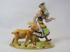 A rare Beswick figurine of a lady and a goat, approx 15cm tall, 17cm long. Model no 1234.