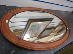 Wooden framed oval bevel edge mirror, 30.5" by 19.5".