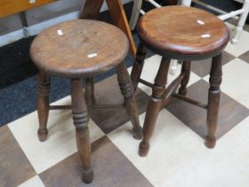 Near pair of round topped oak stools. Each approx 18 inches tall. See photos. S2