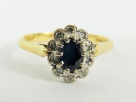 18ct Yellow Gold Ring set with a Central Sapphire and Diamond surround. Finger size 'O' 3.3g