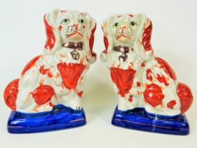 Vintage Matched pair of Mantle Dogs (King Charles) Largest measures approx 9 inches tall. Some lifti