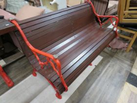 Victorian three seat garden bench with cast metal end and centre panels, cast in naturalist design.