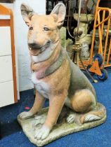 Life size painted concrete model of a large German Shepherd dog. Measures approx 34 inches. Tall.