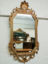 Antique effect plastic framed gilt effect mirror which measures approx 31 x 15 inches. See photos.