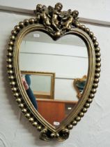 Heart shaped mirror with baubles and cherub decorations. Measures approx 24 x 17 inches. See photos.