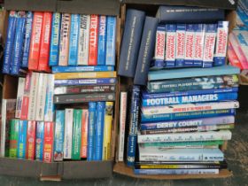 2 boxes of various football related books.