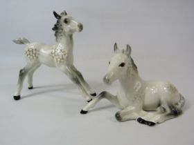 2 Beswick grey foal figurines.