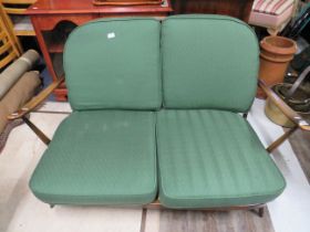 Mid 20th Century Stick back Ercol two seat settee in original unrestored condition.. Seat height 15
