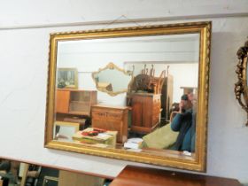 Large Composite framed gilt mirror with bevelled glass. Approx 44 x 34 inches. See photos.