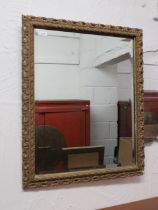 Old Gilt framed bevelled glass mirror which measures approx 16 x 21 inches. See photos.