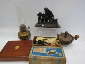 Mixed lot to include a oil lamp, cast iron door stop, knife sharpner etc.