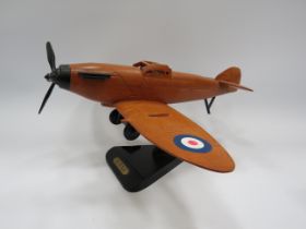 Wooden Spitfire model plane, 16" wide and 8" tall.