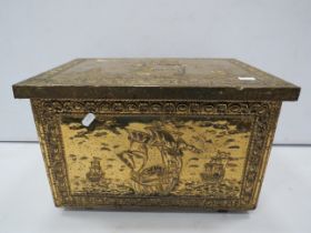 Brass fire side log store box decorated with ships.