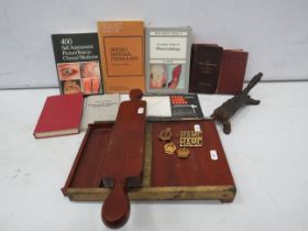 Mixed medical lot including Pill makers, books and Royal Army Medical Corps badges.