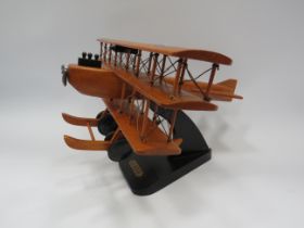 Wooden triplane model, 13" wide and 8.5" tall.